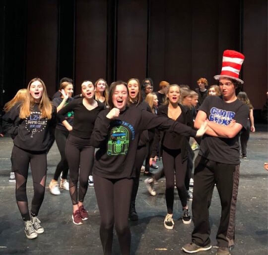 Griffin Brown, senior who plays Cat in the Hat, watches as other members of the cast preform a musical number. “ [In the Seussical] there are some really interesting relationships between characters and some comedy for everyone,” Brown said.