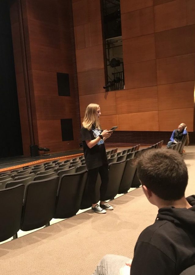 Charity Bash selections include Student Council members presenting potential charities to other club leaders. Maeve Griffin, junior, is shown presenting a potential charity for Charity Bash. 