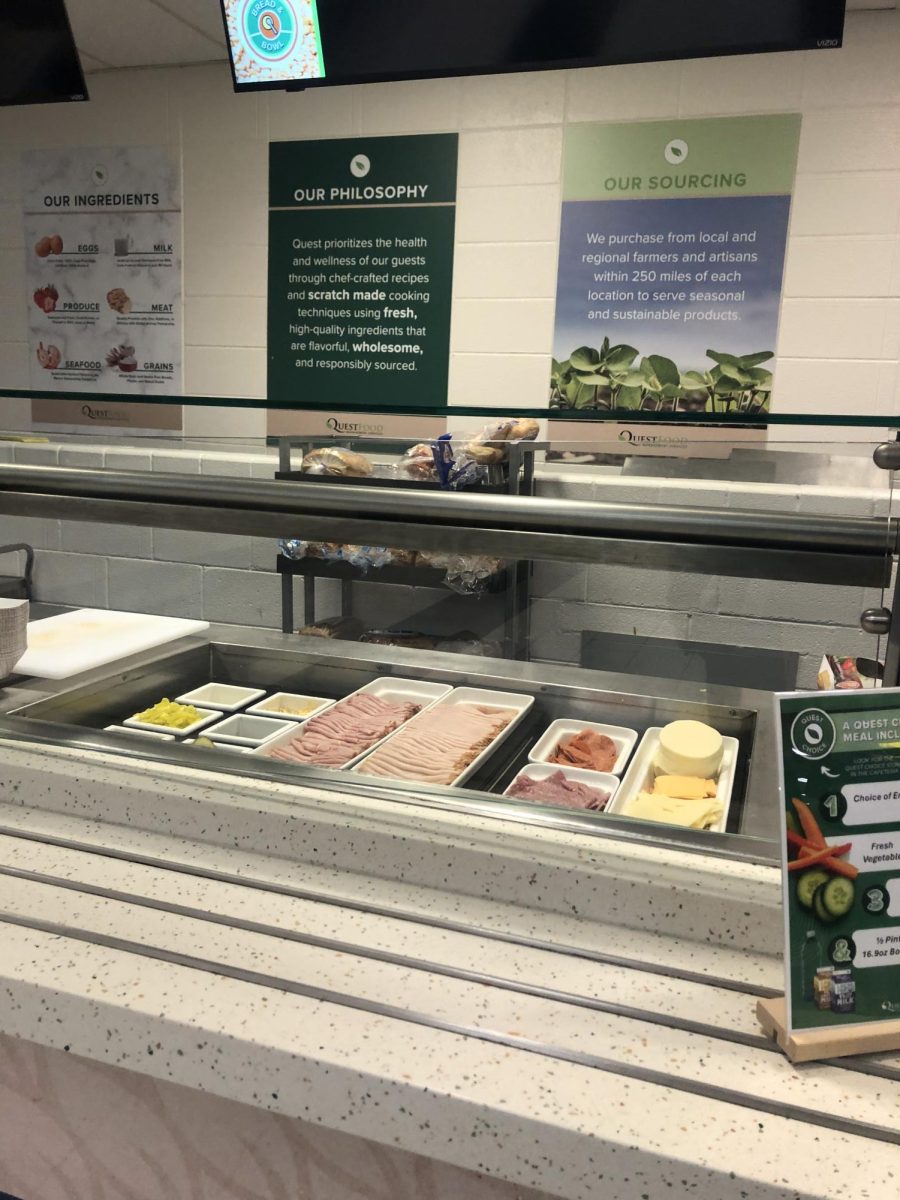 One of the cafeteria options is sandwiches,  which Donapati says that he enjoys a lot. The cafeteria serving line also now has posters from Quest to promote the food service's mission.