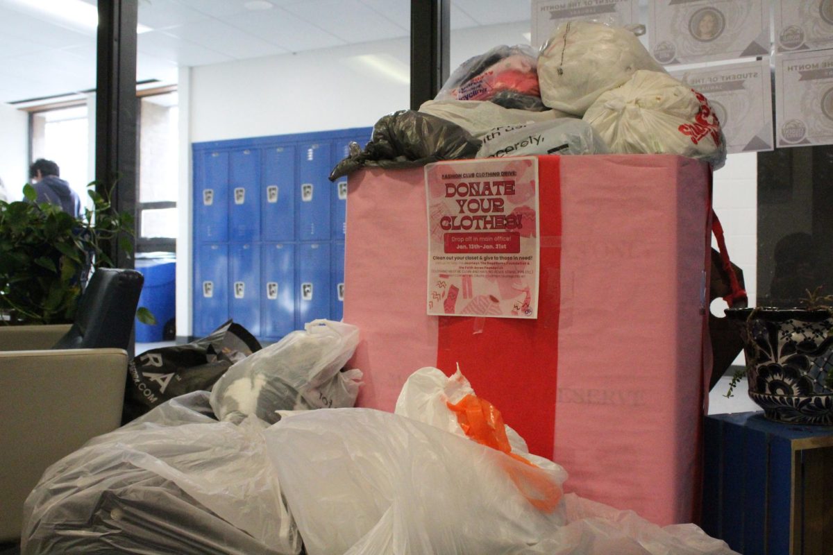 The box of donated clothing in the main office. The Fashion Club will donate all clothing to Faith Acres, a local charity.