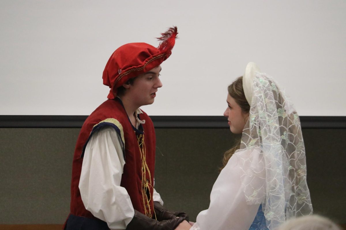 Brennan Monaghan, sophomore, as Romeo and Amanda Lagerlof-Perez, junior, as Juliet, practicing their lines. Actors spent time studying and adjusting to Shakespeare's unique style in an effort to better understand their characters.